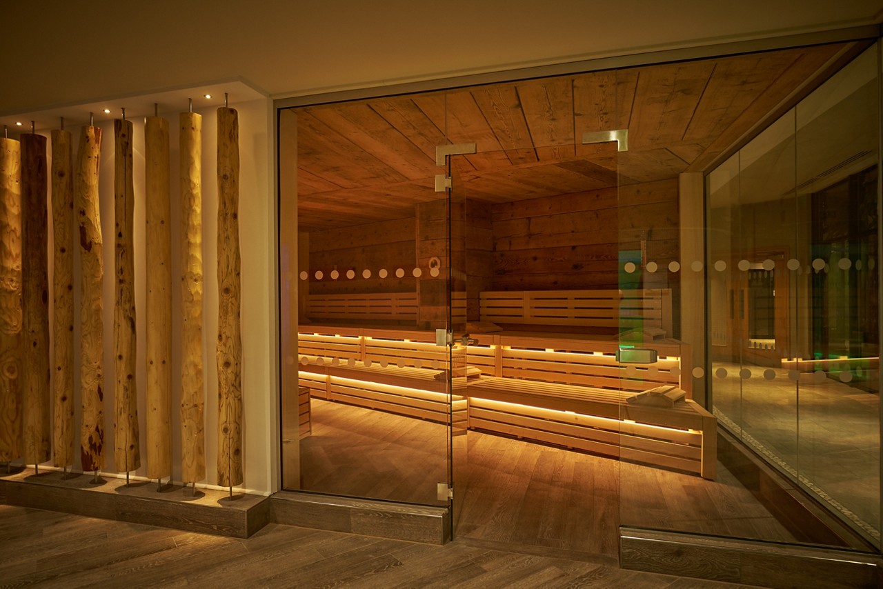 Nordic Sauna with tiered seating and soft lighting.